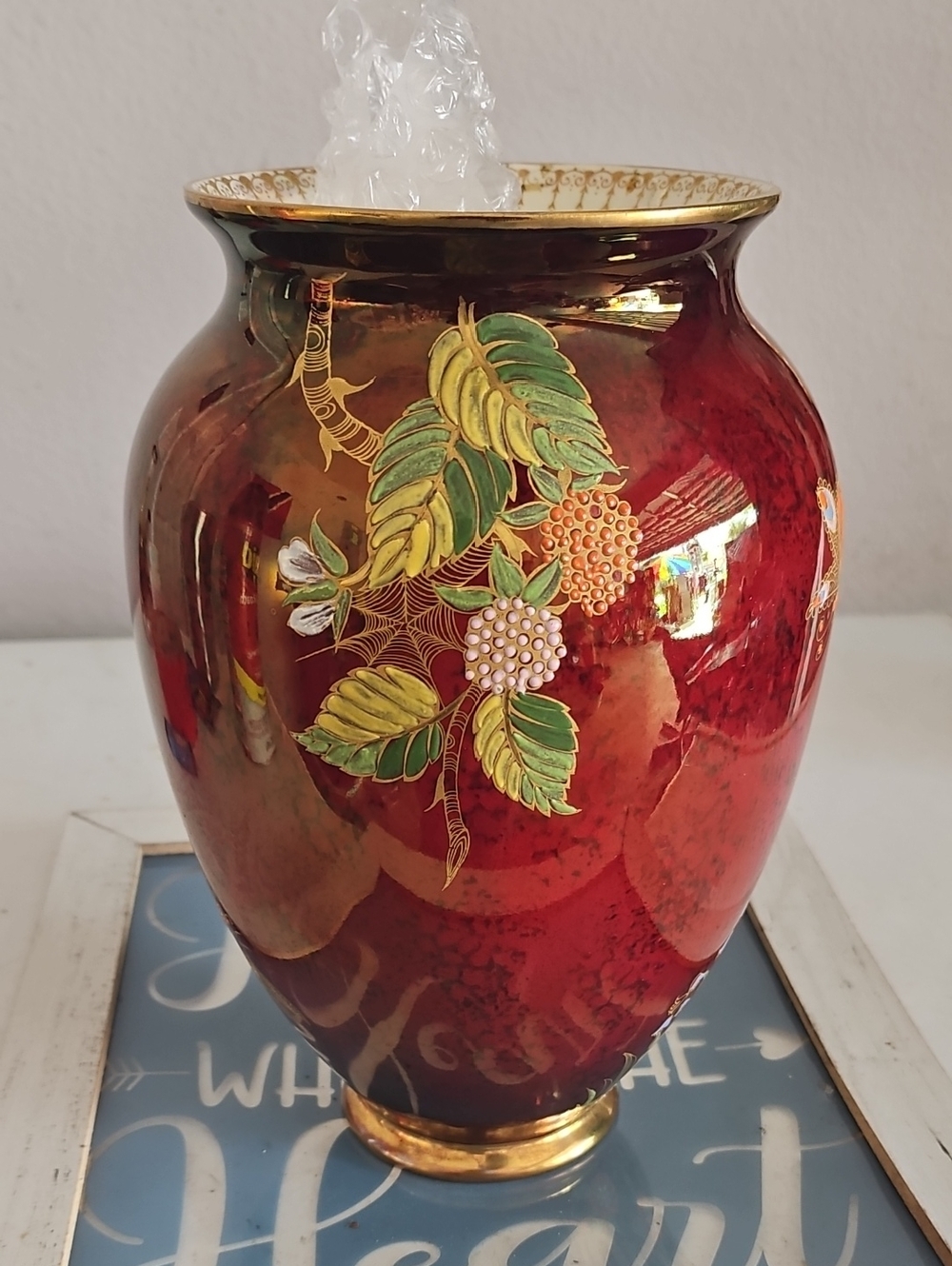 Hand-Painted Red Ceramic Vase with Gold Trim and Floral Motif
